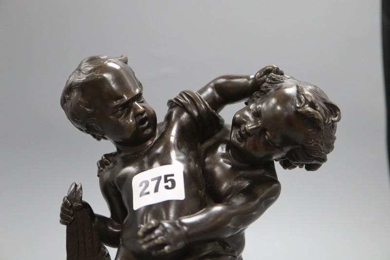 A bronze group of two fighting cherubs, height 23cm